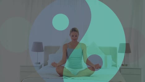 animation of ying yang icon over caucasian woman meditating