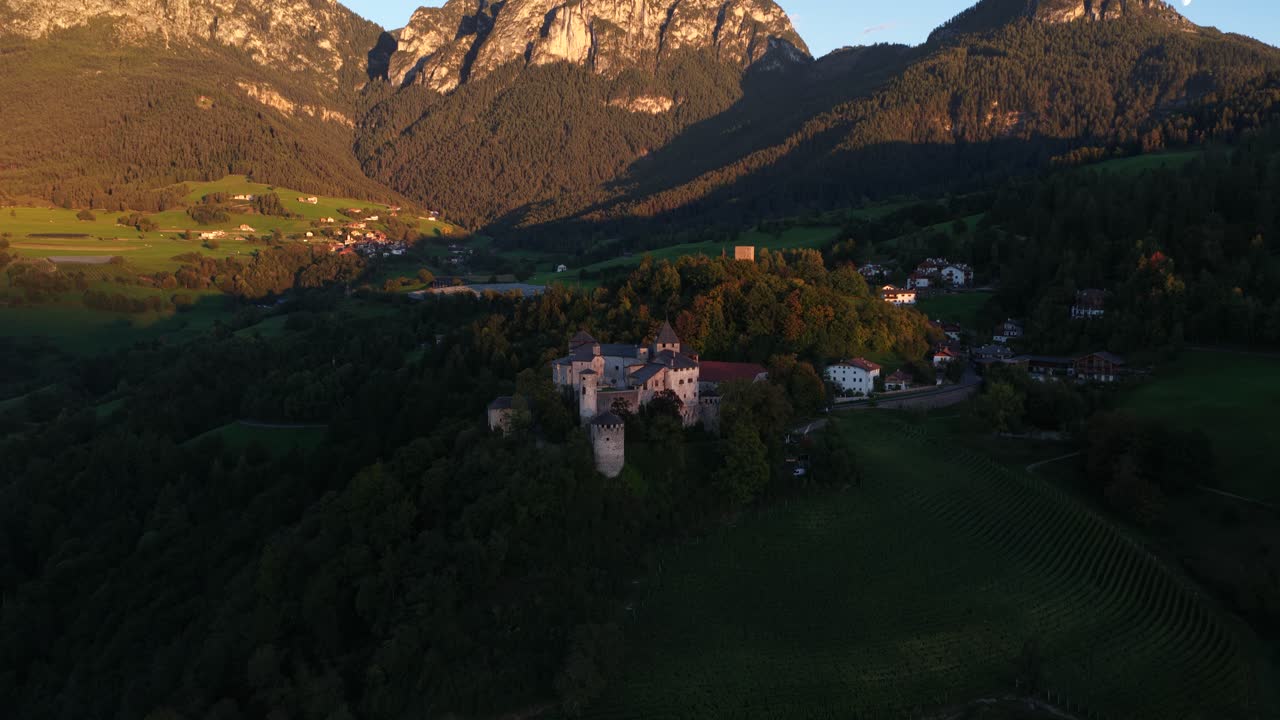 Prosels Castle, gothic style castle on high plain at the Schlern mountain in south tyrol Italy. Aerial video