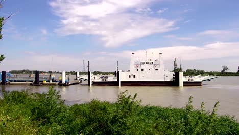 ferry boat carrying vehicles and tourists crosses the rhone in france, video 4k