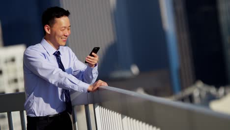 male asian manager working hot spot on rooftop