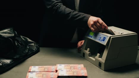 specialised police officer counting dollar banknotes in crime lab, conceptual image. high quality 4k footage