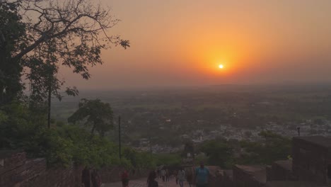 sunrise time lapse with people moving on a indian fort at narwar fort, shivpuri, madhya pradesh