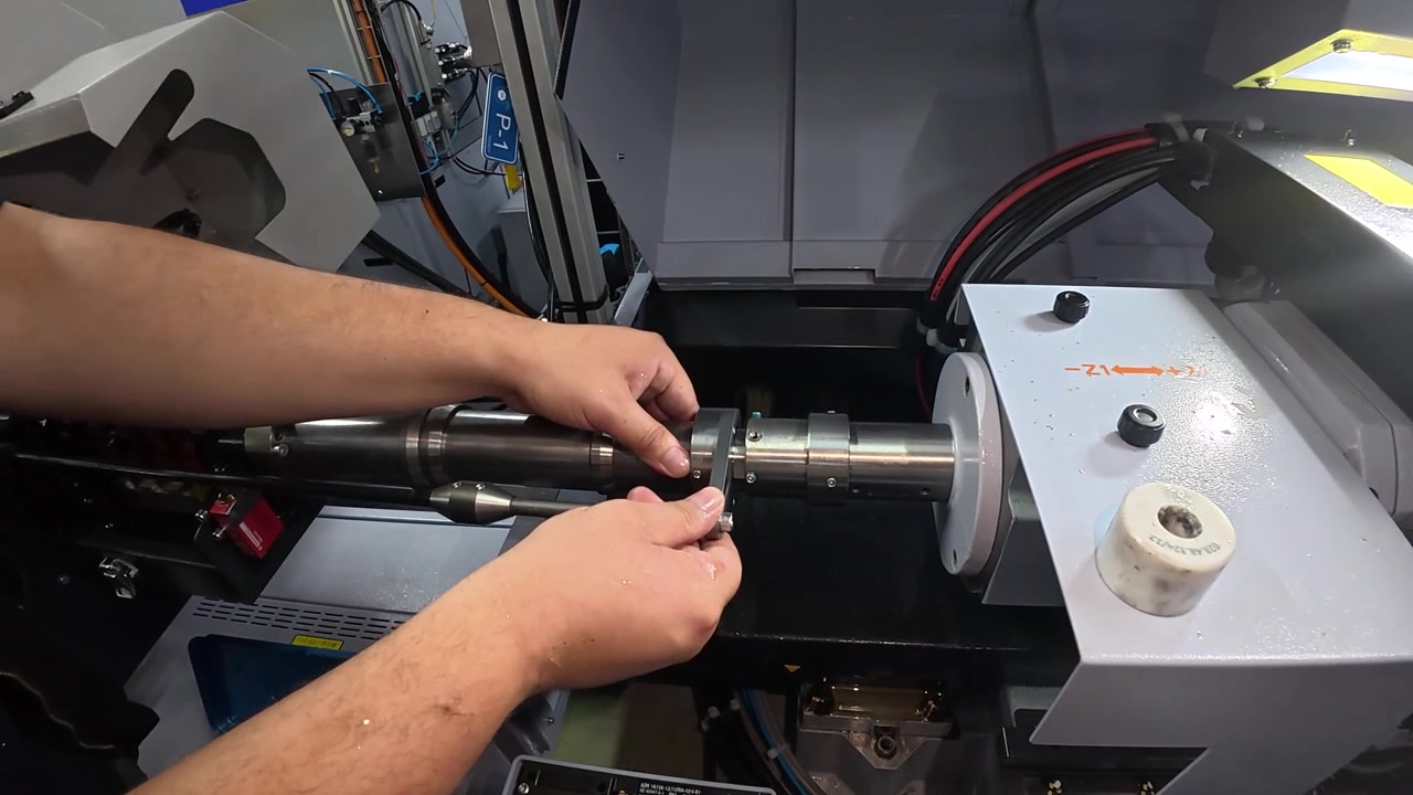A technician performs maintenance and service work on an industrial machine to ensure reliable operation and prevent equipment failures. Concept of preventive maintenance, manufacturing, and industria