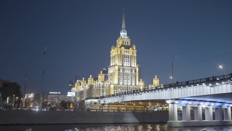 moscow hotel at night under a bridge