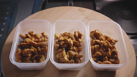 Fried-Chicken-Breast-Fillet-In-Plastic-Food-Containers-On-The-Table