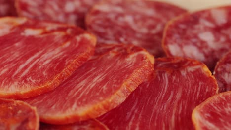 mix of spanish pork sausages, cutting board of appetizing catalonian snack - fuet, jamon, chorizo, olives, supermarket tapas food in spain, traditional cuisine.