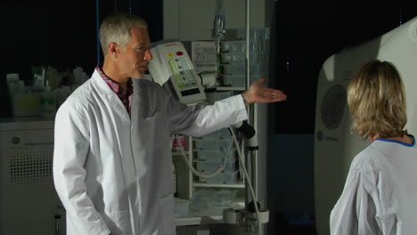 a doctor prepares a patient for a cat scan