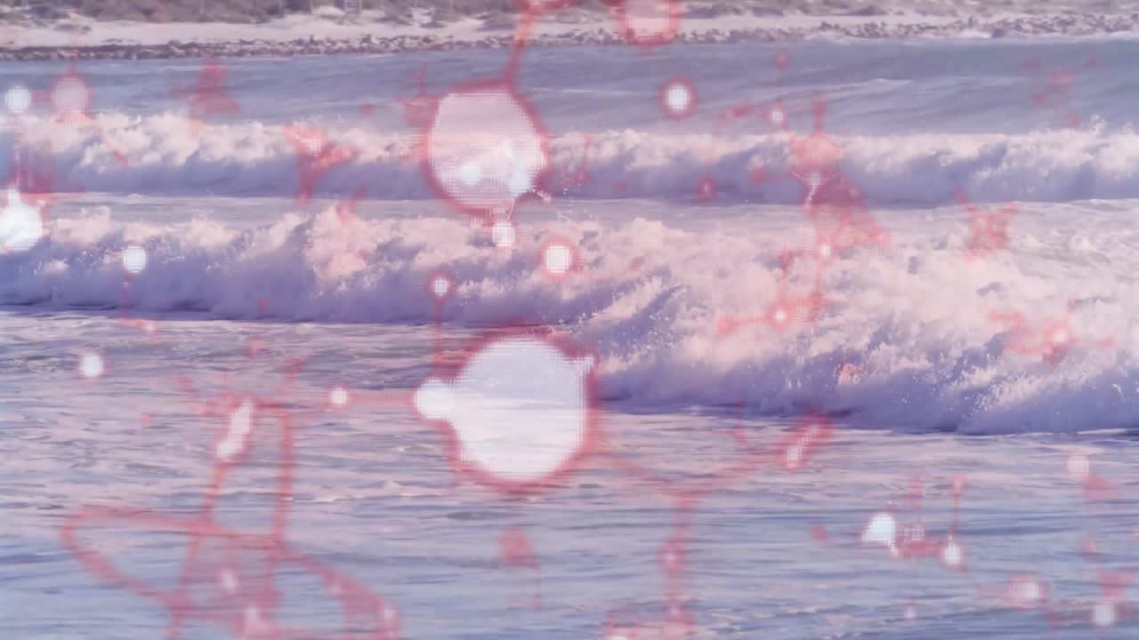 赤い分子構造のアニメーション・オーバーレイが前景にあり、打ち寄せる海の波