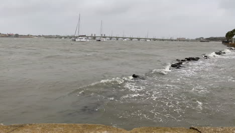 hurricane water surges over flood barrier as storm makes landfall, florida