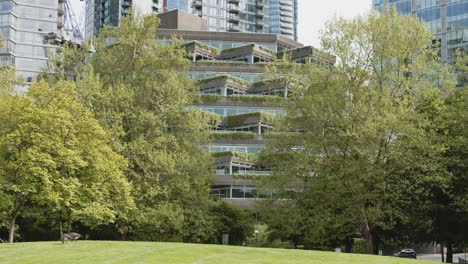 modern building in green city with park in front - vancouver