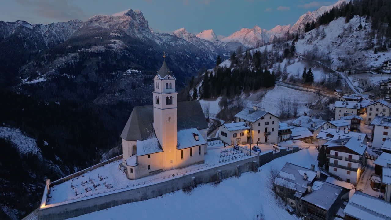 Aerial drone view of the Eglise de Sainte-Lucie in the Colle Santa Lucia comune in Dolomites, Italy