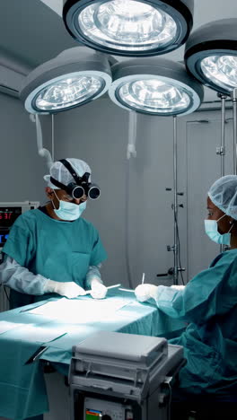 surgeons performing an operation in a brightly lit operating room