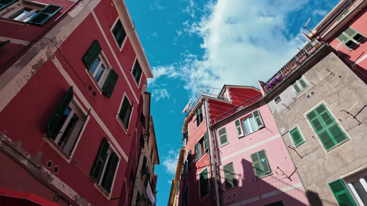 Colorful buildings in Vernazza, Cinque Terre with a view of the blue sky above