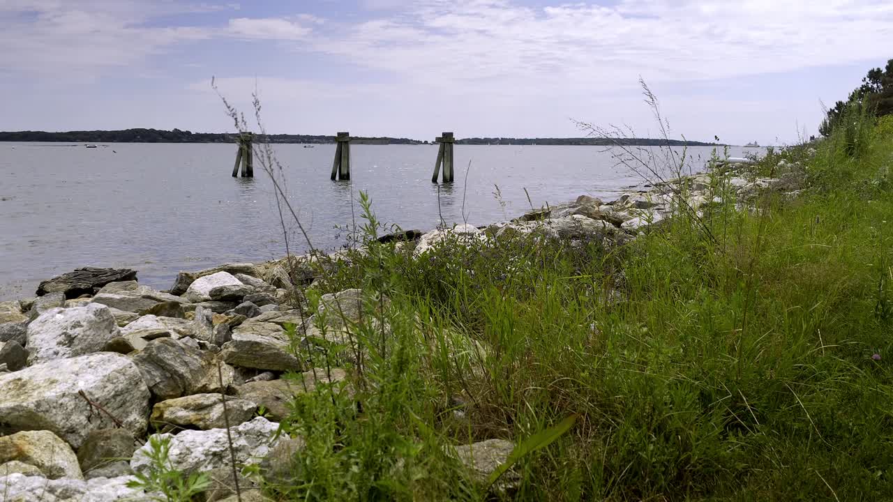 Establish shot Casco Bay Portland, Maine view of Casco Bay and old pilings left over from pier