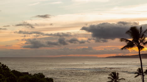 timelapse of clouds rolling over a tropical vibrant ocean sunset in hawaii