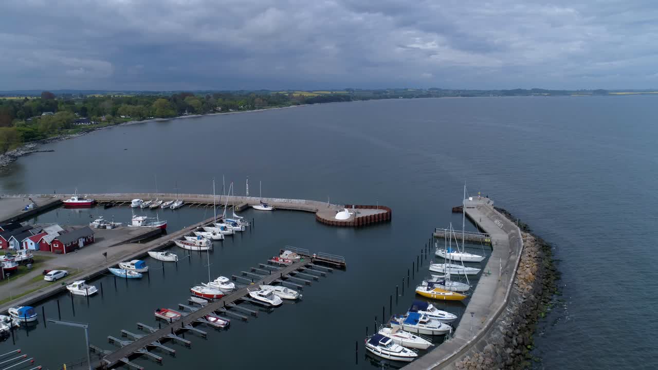 Sailboats And Luxury Yachts Docked At The Marina In A Town In Scania County, Sweden