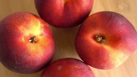 Freshly-picked-ripe-peaches-Rotating