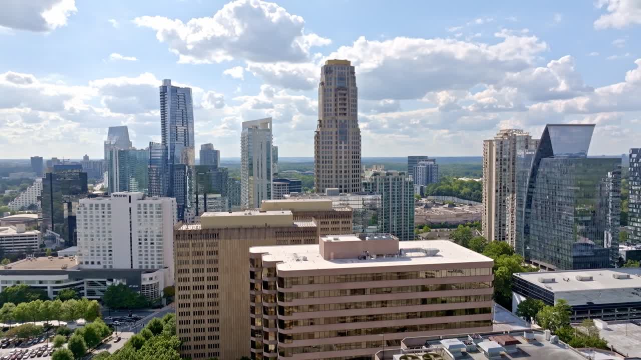 Buckhead highrise and skyline buildings under sunny sky, Atlanta, Georgia, Drone shot