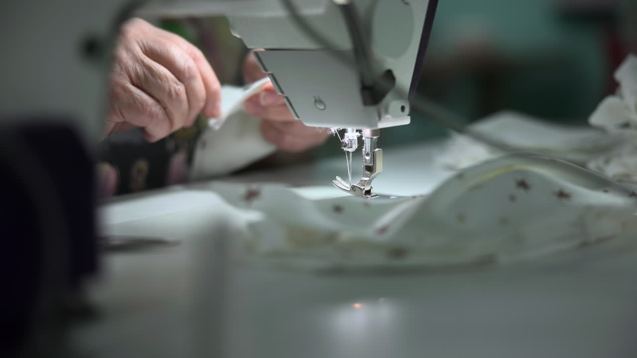 White Seamstress Adjusting Needle Tension On Sewing Machine, Closeup Hands Manipulating Presser Foot. Media