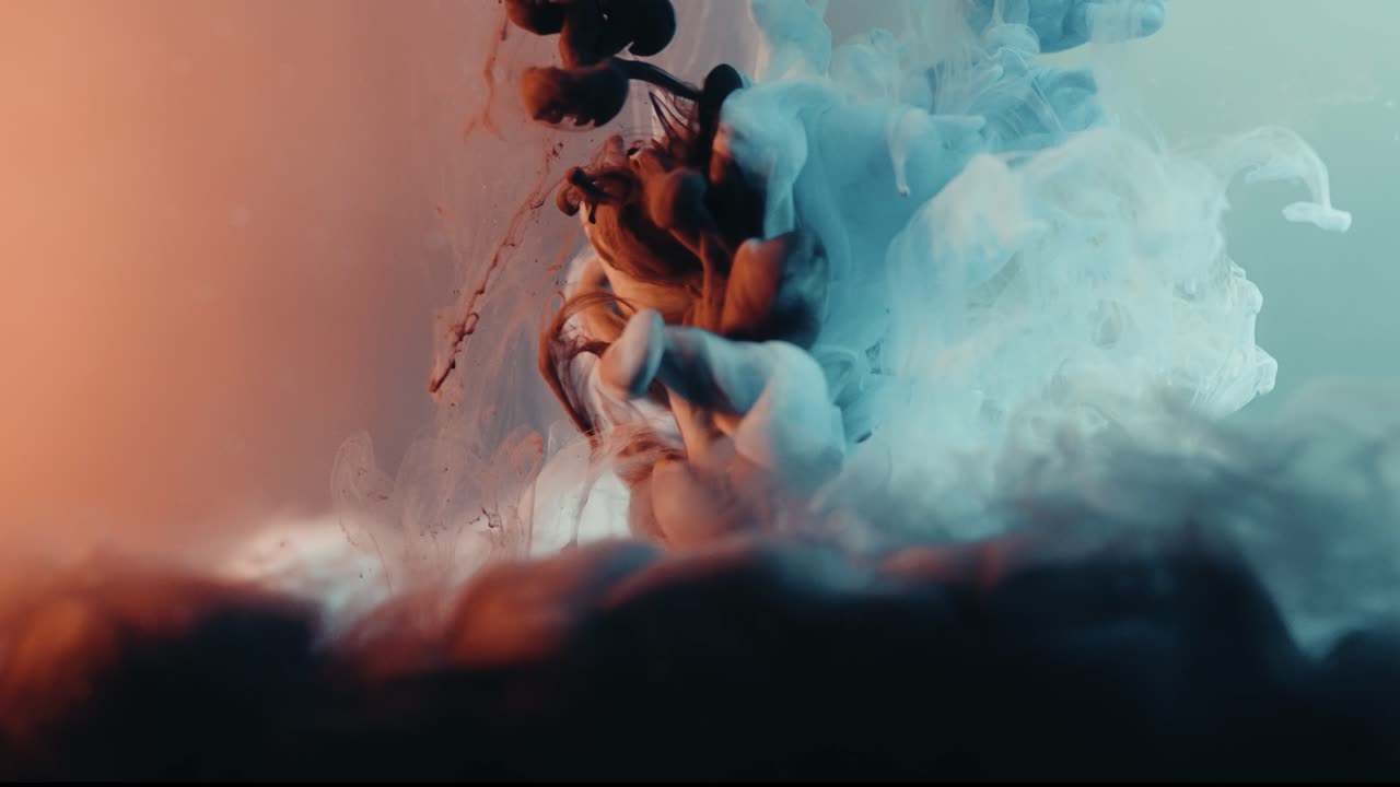 Colorful Liquid Smoke Merging And Mixing. slow motion