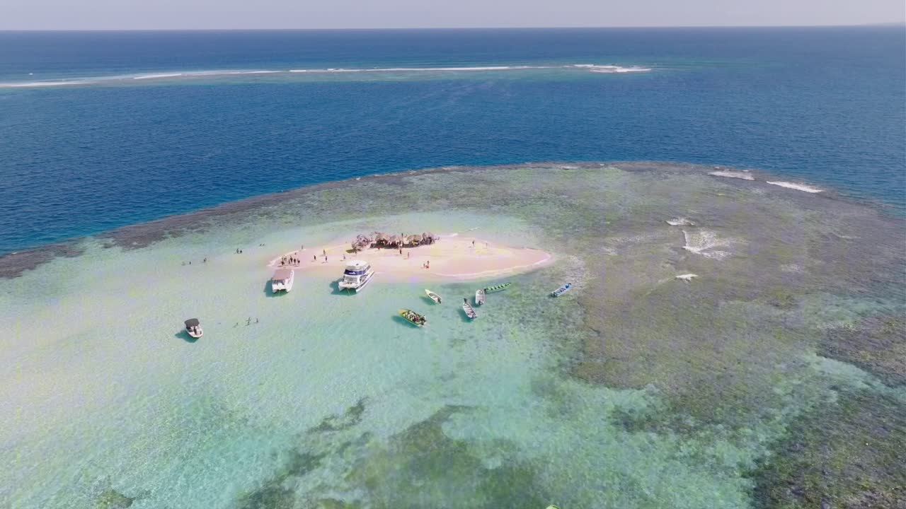 Aerial View of Tourist Boats Around Small Caribbean Island and Coral Reefs. Cayo Arena, Dominican Republic