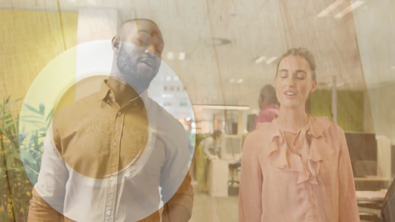 Coworkers discussing business project in office, showcasing animated circular overlay graphic