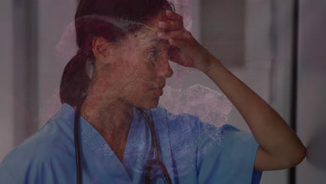 digital waves against stressed female health worker sitting in the corridor at hospital