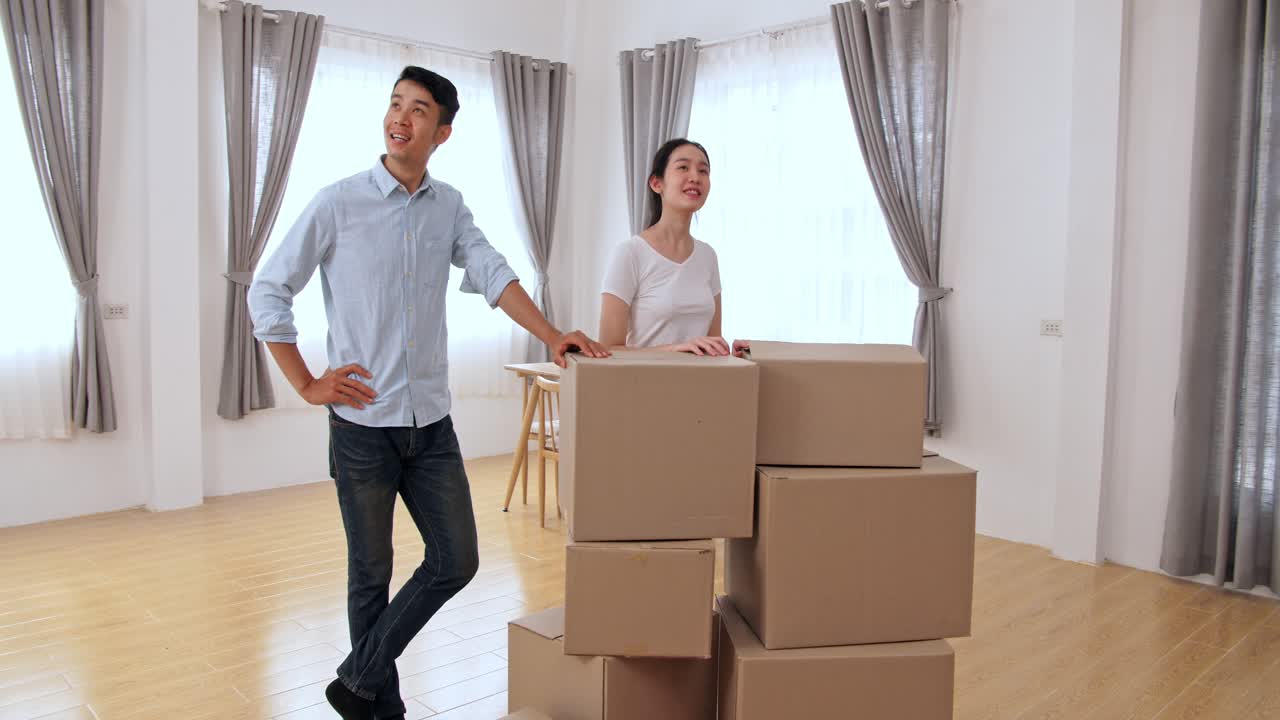 Asian Couple In The New Home