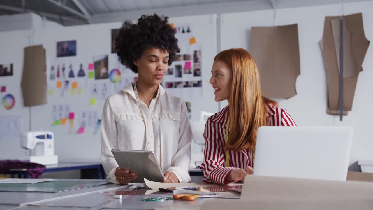 Two colleagues working in fashion office