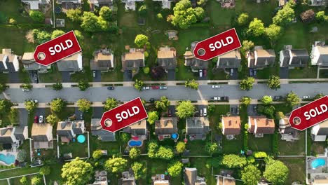 aerial view of a neighborhood with sold signs over several houses