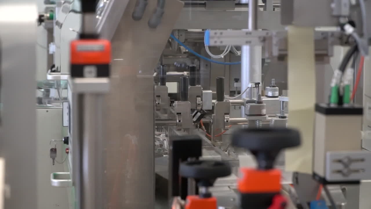 Pharmaceutical automated machine works efficiently in laboratory, dolly right