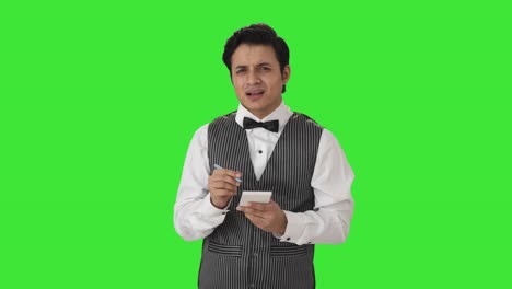 Confused-Indian-waiter-taking-order-from-customer-Green-screen