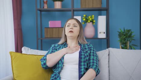 young woman with shortness of breath is breathing hard.