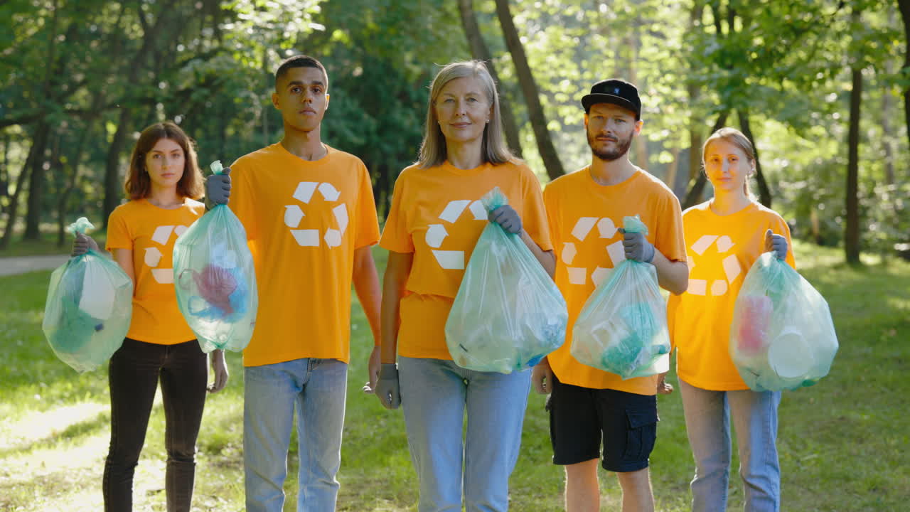 Group of Volunteers Cleaning Up Litter in Park