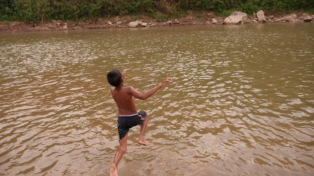 Child Swimming in a River