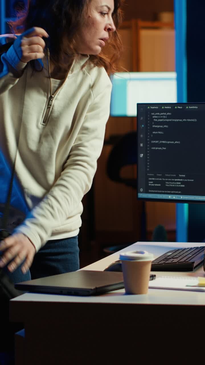 Vertical video Developer holding disposable cup of coffee entering home office