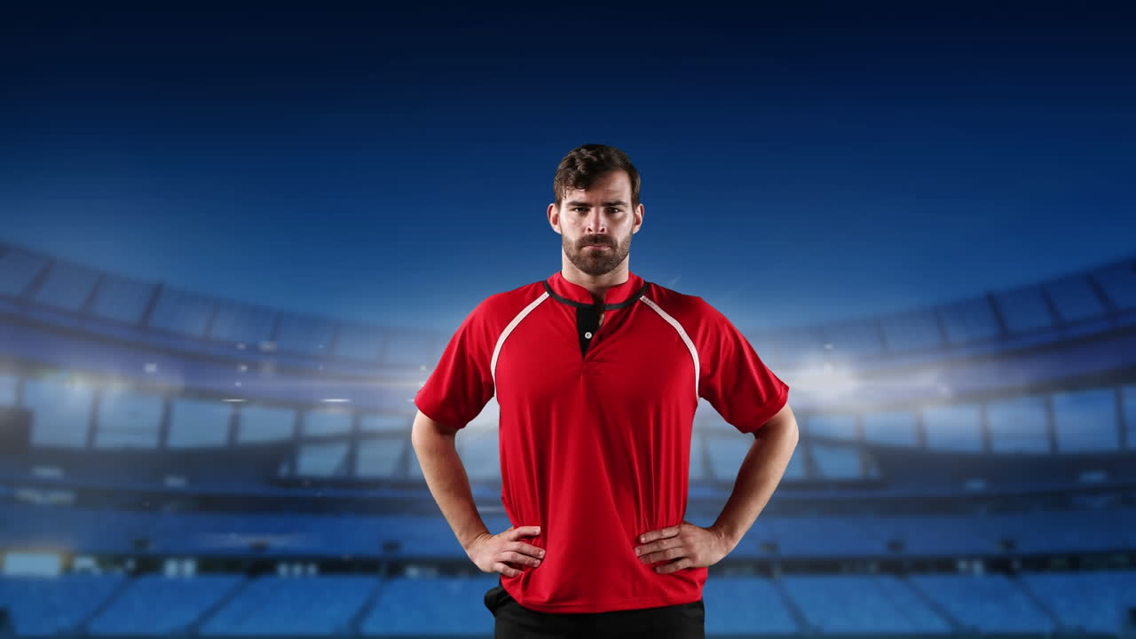 프로 럭비 선수 가 경기장 앞 에 서 있다