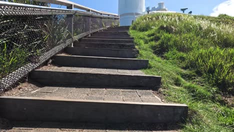 progressive climb up stairs towards a lighthouse