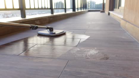 cleaning a balcony floor