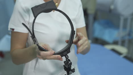 medical tool for eye surgery. surgeon holding medical instruments in hands