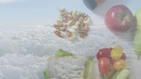 animation of fruits, nuts, and vegetables overlaying ocean waves for fresh concept