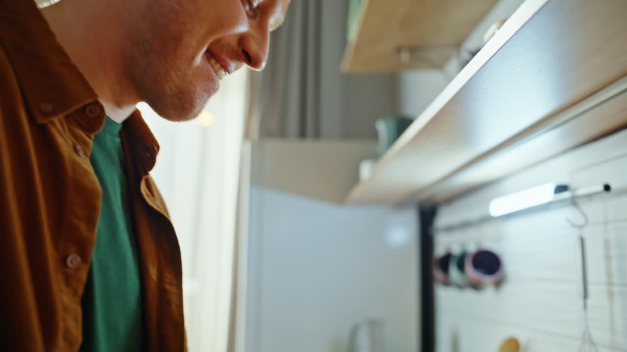 Closeup guy tasting soup cooking dish at kitchen. Portrait chef satisfied food