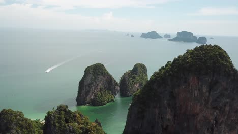 drone aerial view on limestone seacliffs over tropical sea