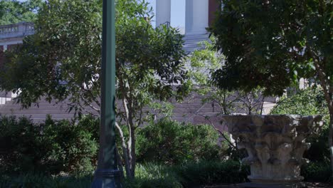 Light-pole-and-Rotunda-on-the-campus-of-the-University-of-Virginia-in-Charlottesville,-Virginia-with-tilt-up-from-light-pole-to-Rotunda-in-slow-motion