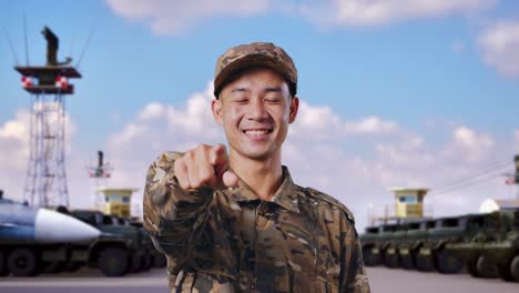 smiling soldier pointing