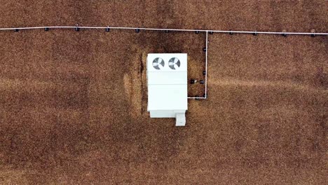 an ascending aerial view of hvac units, on top of a commercial building