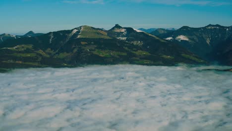 cinemagraph / seamless video loop of fog clouds and haze above a natural canyon in the bavarian alps toward salzburg, autria in winter in germany. the clouds are moving fast as time lapse. 4k uhd