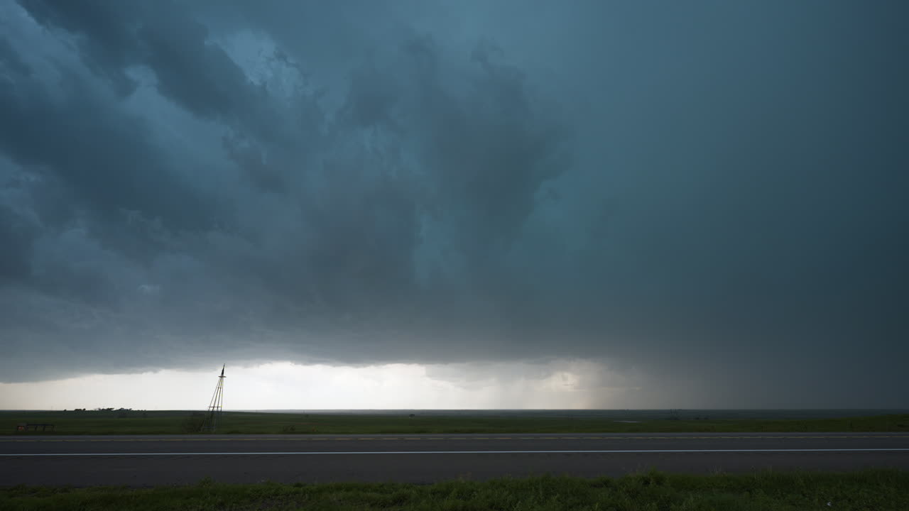 Car Drives By Scary Powerful Stormy Sky Above