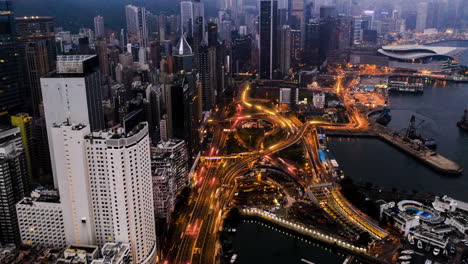 Fast-highway-traffic,-aerial-night-cityscape