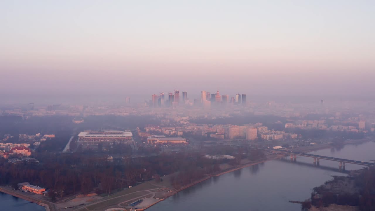 Skyscrapers in Warsaw above the fog during sunrise.